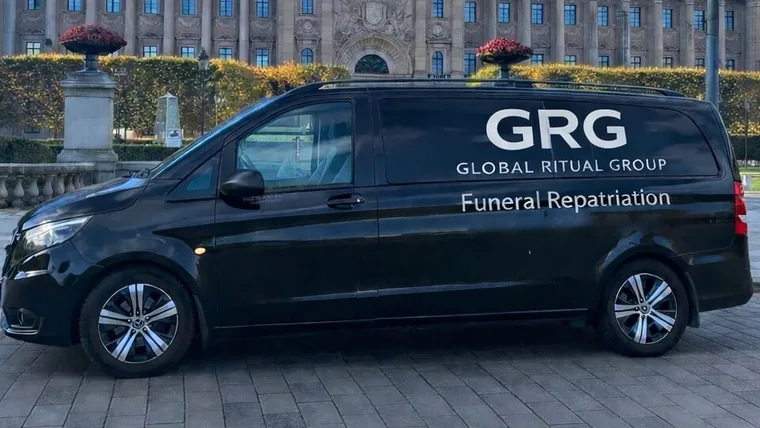 Black GRG funeral repatriation van, side view